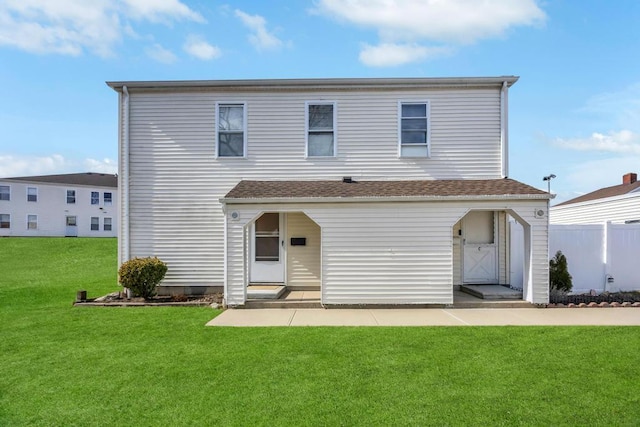 view of front of house featuring a front yard, fence, and entry steps