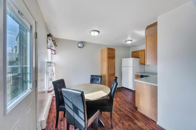 dining room with dark wood-type flooring