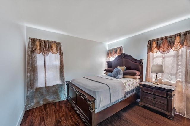 bedroom featuring dark wood-type flooring