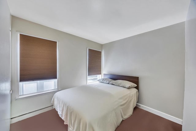 bedroom featuring baseboards and baseboard heating