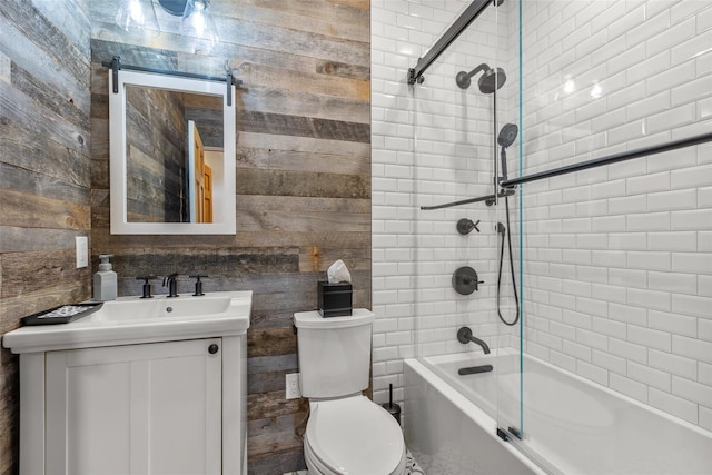 full bathroom featuring toilet, washtub / shower combination, and vanity