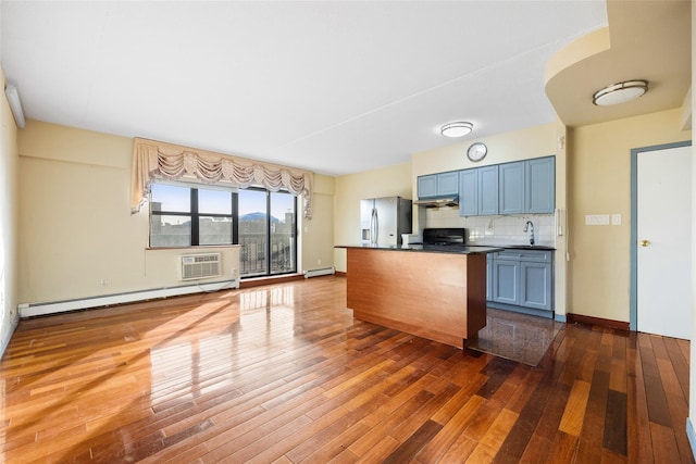 kitchen featuring blue cabinetry, backsplash, dark hardwood / wood-style floors, stainless steel fridge with ice dispenser, and a baseboard radiator