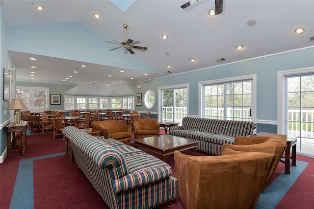 living room with dark colored carpet, recessed lighting, visible vents, a ceiling fan, and high vaulted ceiling