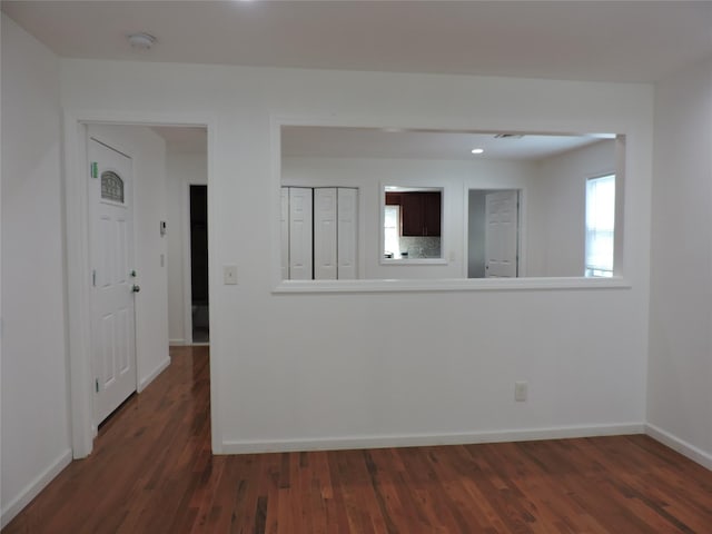 spare room featuring dark hardwood / wood-style flooring