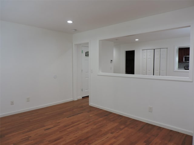 spare room featuring dark hardwood / wood-style floors