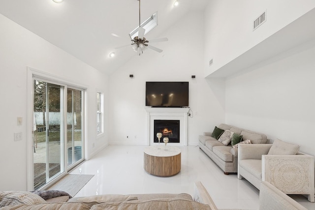 tiled living room featuring high vaulted ceiling and ceiling fan