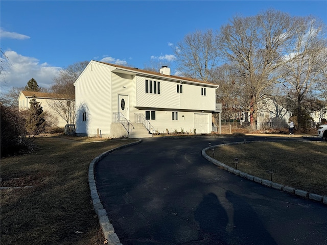 back of house with a garage