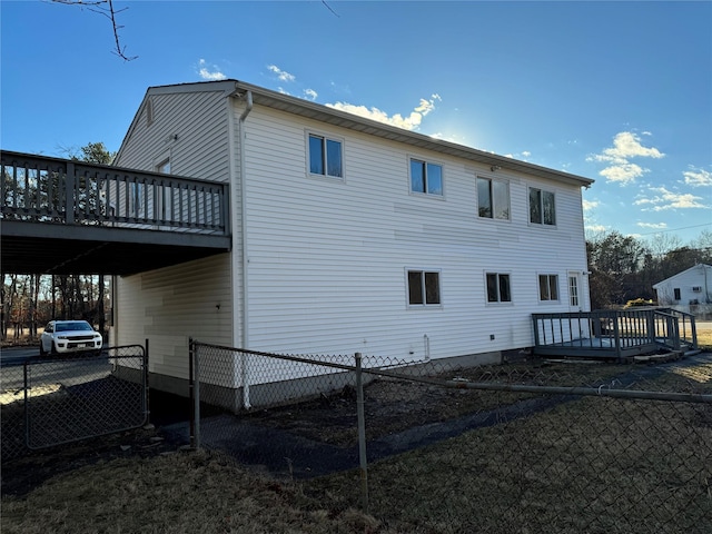 view of side of home featuring a deck