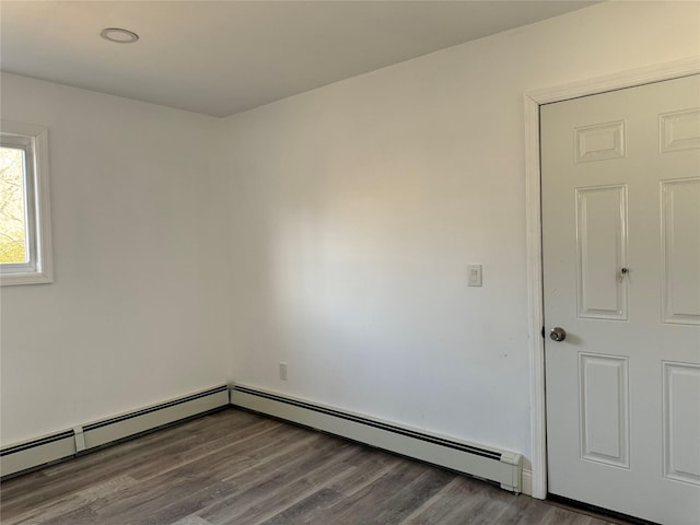 empty room with hardwood / wood-style flooring