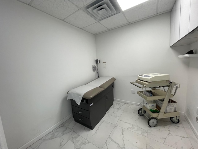 bathroom with a paneled ceiling