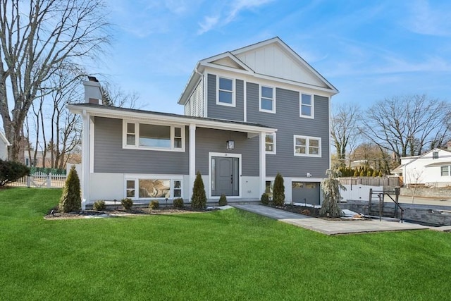 view of front facade with a front yard and a garage