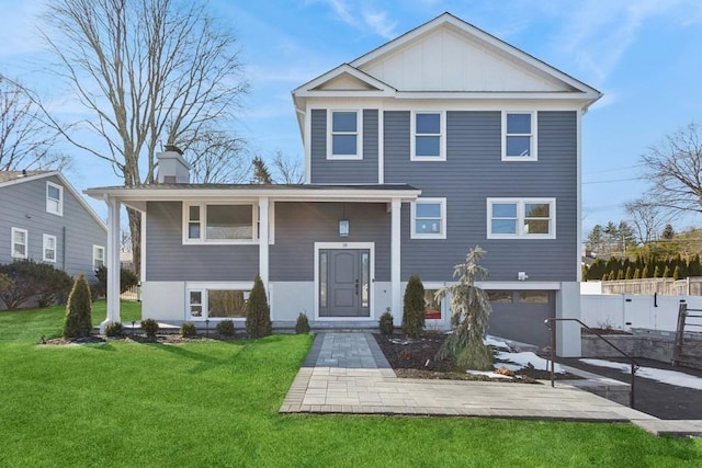 view of front facade featuring a garage and a front lawn