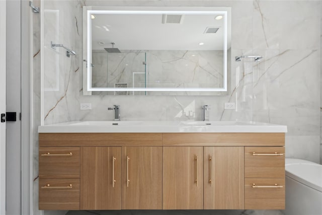 bathroom with backsplash, tile walls, vanity, walk in shower, and toilet