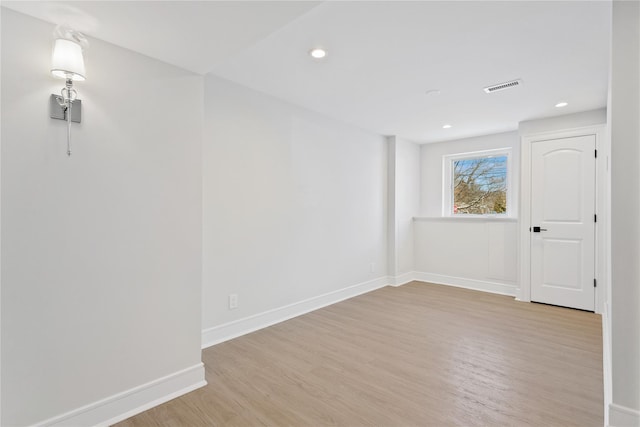 empty room with light wood-type flooring