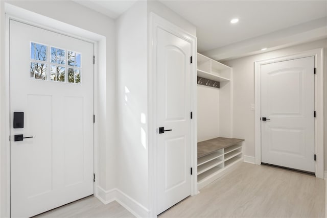 mudroom with light hardwood / wood-style floors