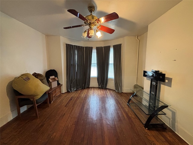 interior space with dark hardwood / wood-style floors and ceiling fan