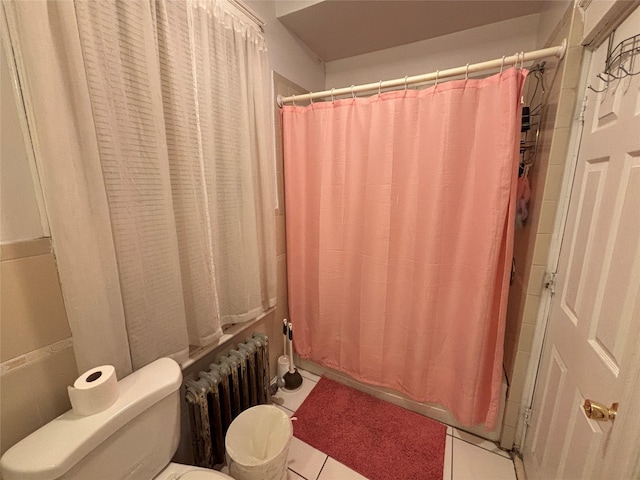 bathroom with shower / bathtub combination with curtain, radiator heating unit, tile patterned floors, and toilet