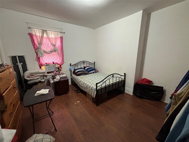 bedroom featuring dark wood-type flooring