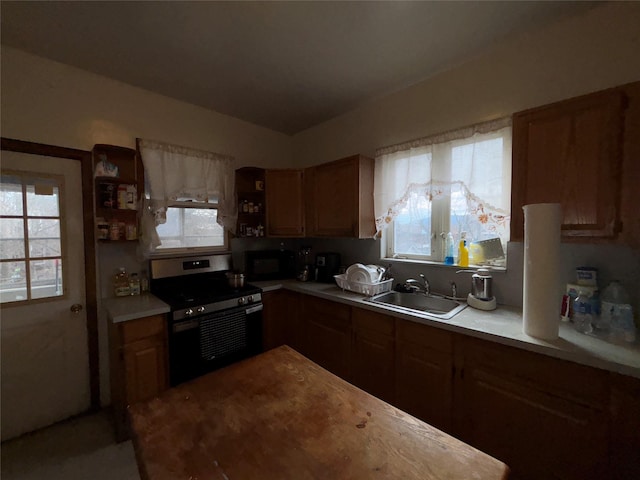 kitchen with electric stove and sink