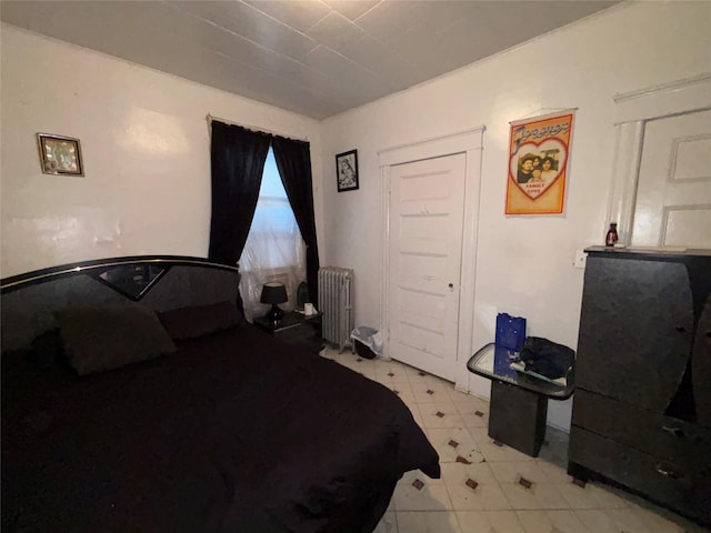 bedroom with radiator heating unit