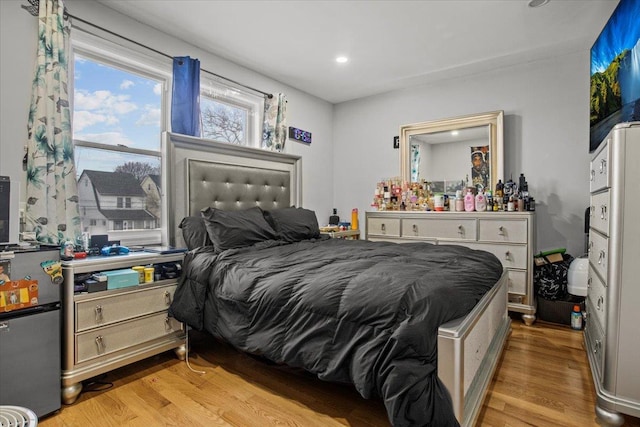 bedroom with light hardwood / wood-style flooring