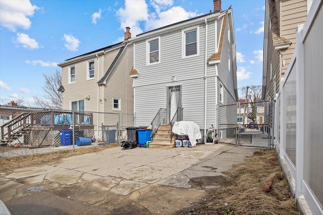 back of house with a patio