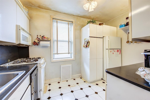 kitchen featuring white cabinetry, white appliances, and sink