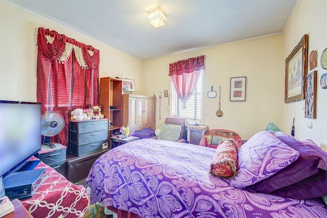 bedroom with hardwood / wood-style flooring