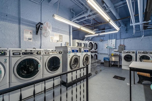 washroom featuring washing machine and dryer