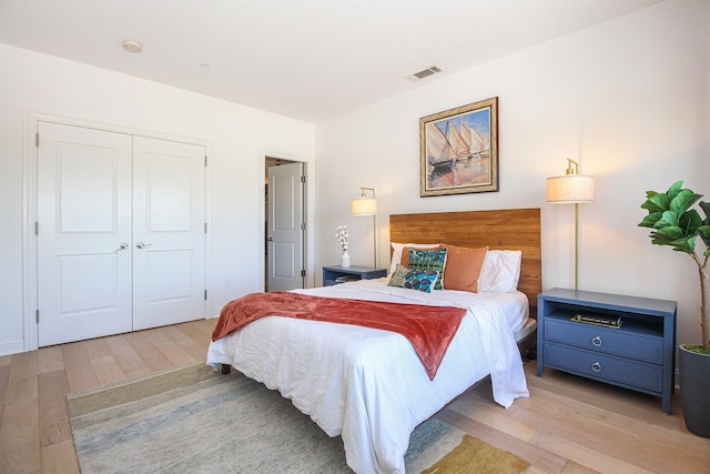 bedroom featuring a closet and light wood-type flooring