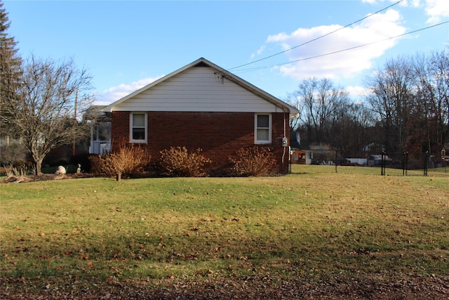 view of property exterior with a yard