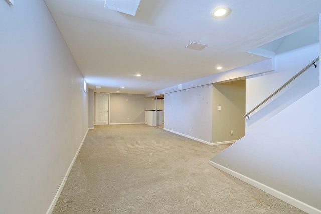 basement with light colored carpet