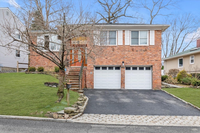 view of front of home featuring a garage and a front lawn