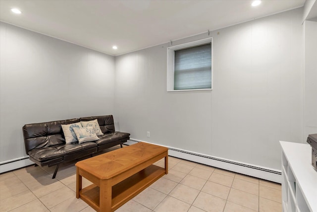 living room featuring a baseboard heating unit and light tile patterned floors