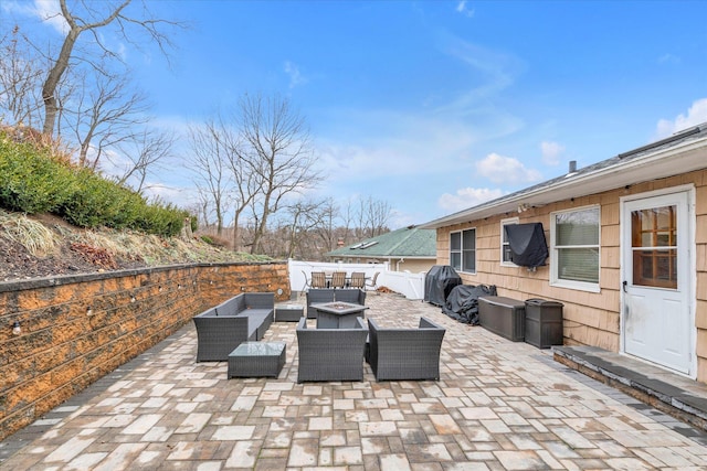 view of patio / terrace featuring an outdoor living space and a grill