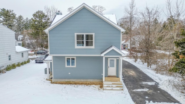 view of snow covered house