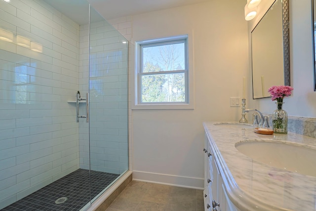 bathroom with vanity, tile patterned floors, and a shower with door