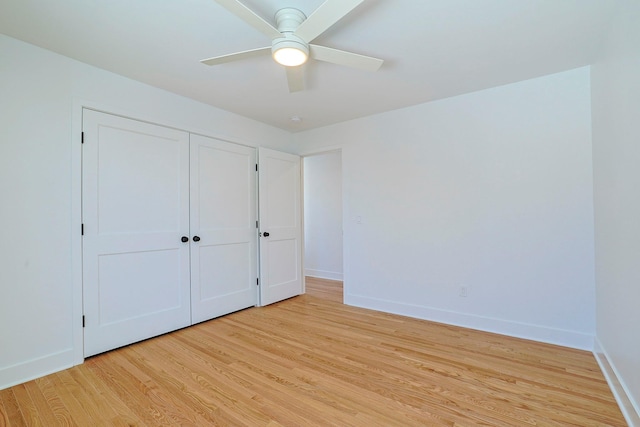 unfurnished bedroom featuring a closet, ceiling fan, and light hardwood / wood-style flooring