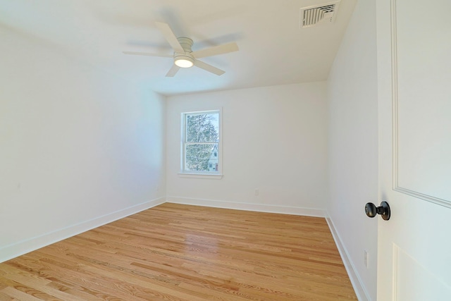 empty room with ceiling fan and light wood-type flooring