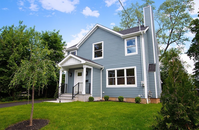 12 Observatory Dr, Croton-On-Hudson, NY 10520 - view of front of home with a chimney and a front lawn