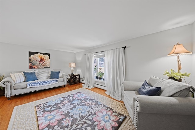 living room featuring a baseboard radiator and hardwood / wood-style floors