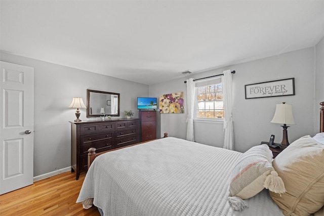 bedroom with light wood-type flooring