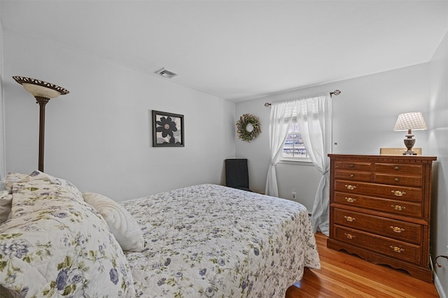 bedroom featuring light hardwood / wood-style floors