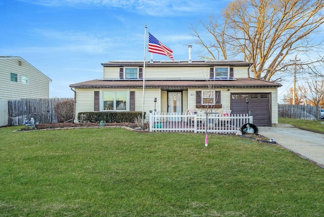 front of property featuring a garage and a front yard