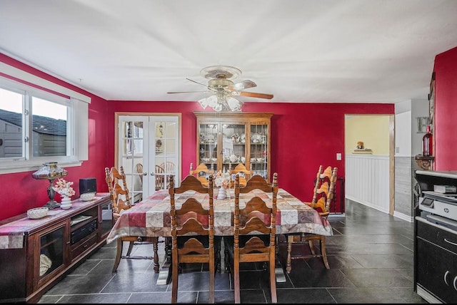 dining area with french doors and ceiling fan