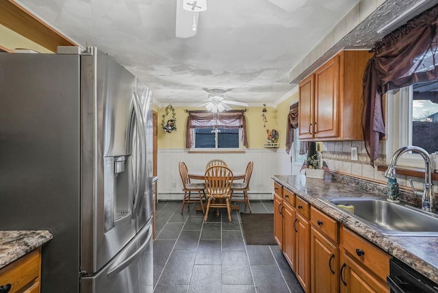 kitchen featuring dishwasher, sink, ornamental molding, ceiling fan, and stainless steel refrigerator with ice dispenser