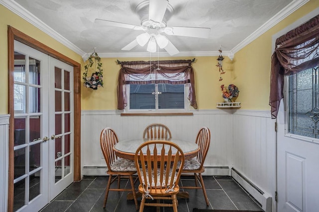 dining room with french doors, a baseboard radiator, and dark tile patterned flooring