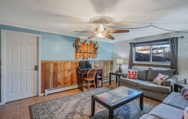 tiled living room featuring ceiling fan, brick wall, ornamental molding, and a baseboard heating unit