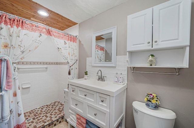 bathroom featuring tasteful backsplash, vanity, toilet, and walk in shower