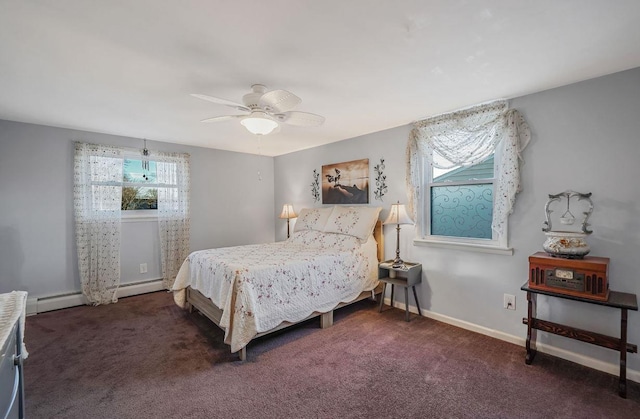 carpeted bedroom with ceiling fan and baseboard heating